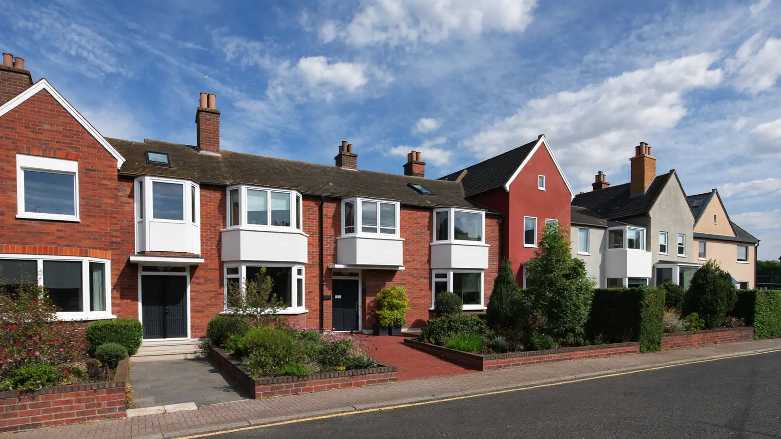 A UK residential street of homes with modern double glazing